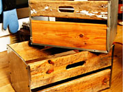 Broken microwave oven cases turned into crates with pallet wood